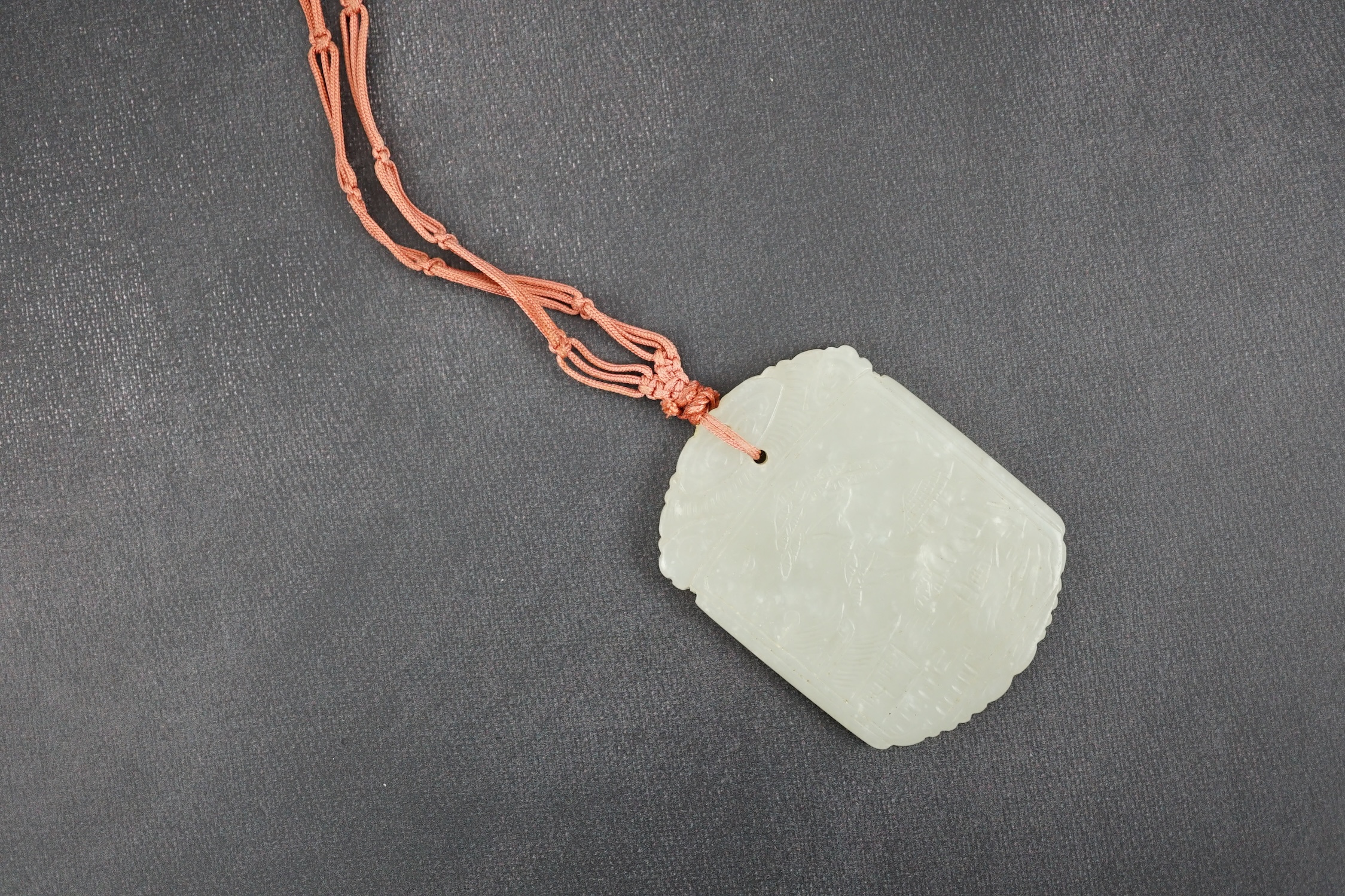 An unusual Chinese pale celadon jade plaque, 19th century